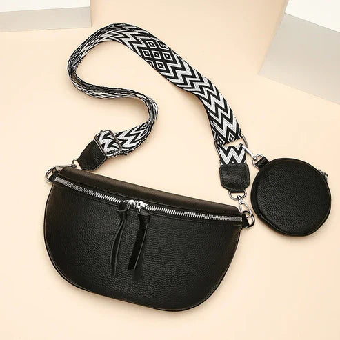 Schwarze Leder-Bauchtasche mit geometrischem Schultergurt und rundem Münzbeutel. Modische Gürteltasche, ideal für Reisen und Alltag.