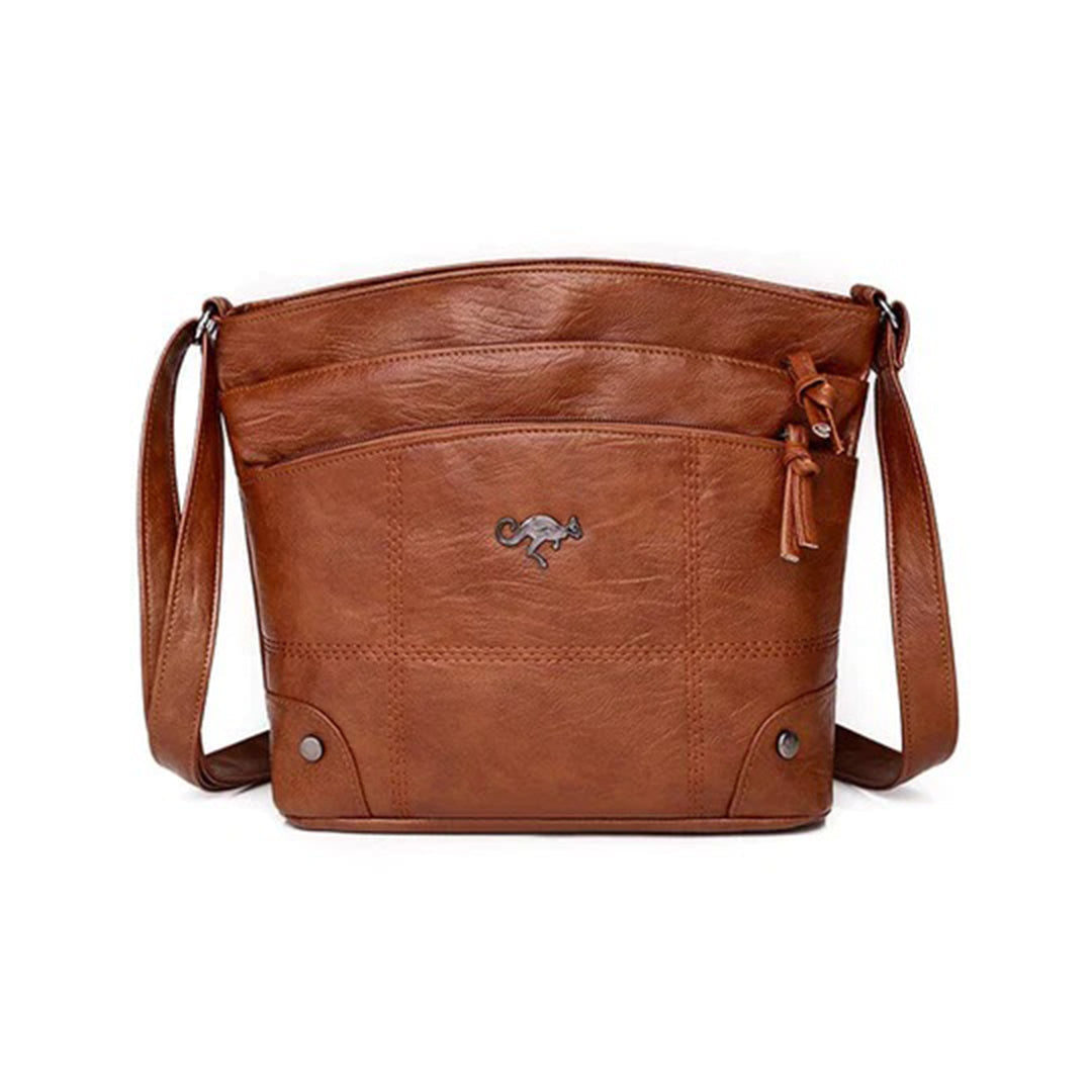 Braune Ledertasche mit verstellbarem Schulterriemen, elegantes Design, ideal für Damen. Perfekt für Alltag und Büro. Hochwertige Verarbeitung.