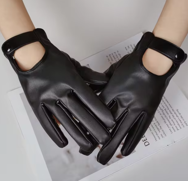 Schwarze Lederhandschuhe mit Knopfverschluss, elegant und stilvoll, ideal für Herbst- und Wintermode. Perfekt für Damenaccessoires.