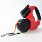 Robuste Hundeleine für zwei Hunde, rot-schwarz, mit ergonomischem Griff und integrierter Taschenlampe. Ideal für Spaziergänge bei Nacht.