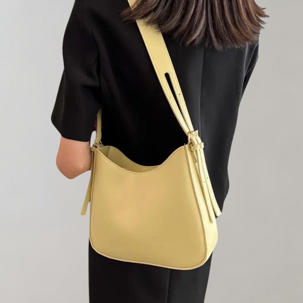 Damenhandtasche in Gelb, Umhängetasche aus Leder, modisches Accessoire, ideal für Alltag und Büro, stilvoll und praktisch.