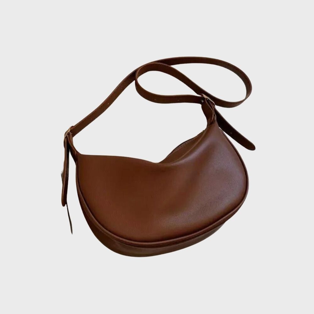 Braune Lederhandtasche im Halbmond-Design, stilvoll und modern. Perfekt für Damenmode, Accessoires, Taschen, elegantes Design, Alltag.