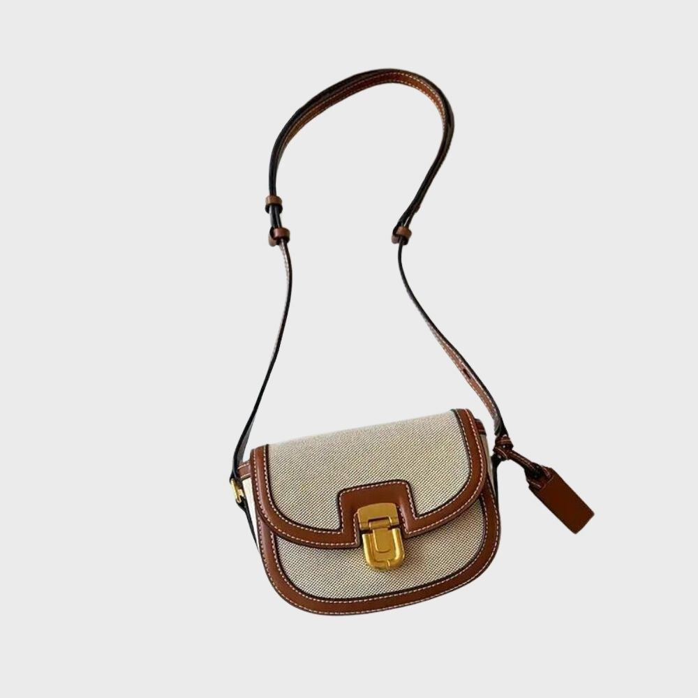 Elegante Umhängetasche aus Leinen und Leder mit goldener Schnalle. Perfekt für stilvolle Damenmode und Accessoires. Ideal für Alltag und Events.