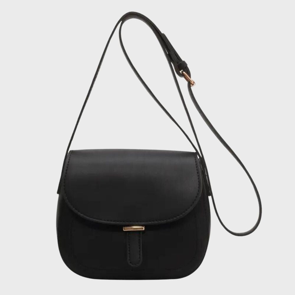Schwarze Lederhandtasche mit verstellbarem Schulterriemen und goldener Schnalle. Elegantes Design, ideal für Damenmode und Accessoires.