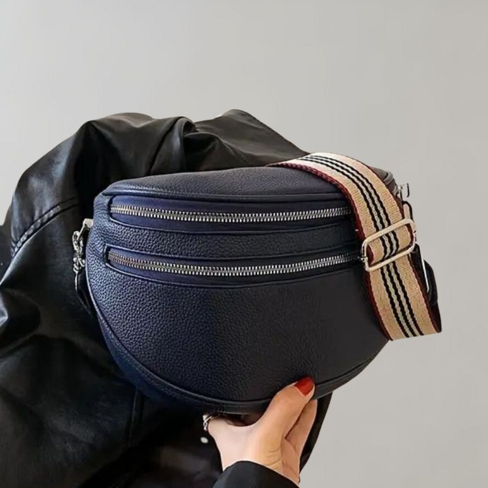 Dunkelblaue Leder-Gürteltasche mit verstellbarem Streifenriemen und doppeltem Reißverschluss, ideal für stilvolle und praktische Aufbewahrung.