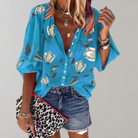 Damenbluse blau mit Blumenmuster, V-Ausschnitt, Sommermode, lässig, kurzärmelig.