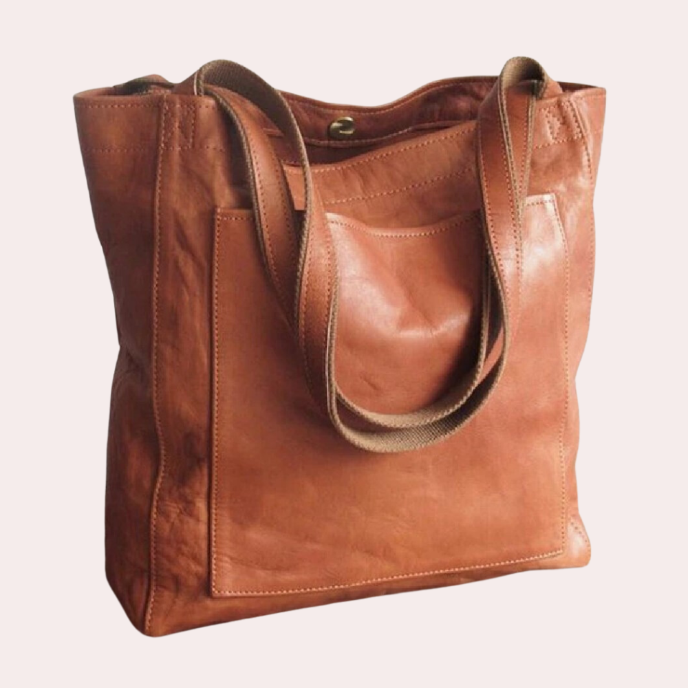 Braune Ledertasche mit robusten Trägern, ideal für den Alltag. Hochwertiges Design, geräumig und stilvoll. Perfekt für Damenmode und Accessoires.