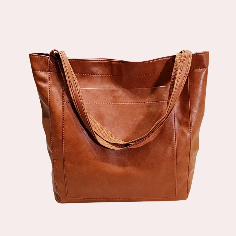 Braune Ledertasche mit geräumigem Hauptfach, ideal für den Alltag. Hochwertiges Design, langlebig und stilvoll. Perfekt für Damenmode.