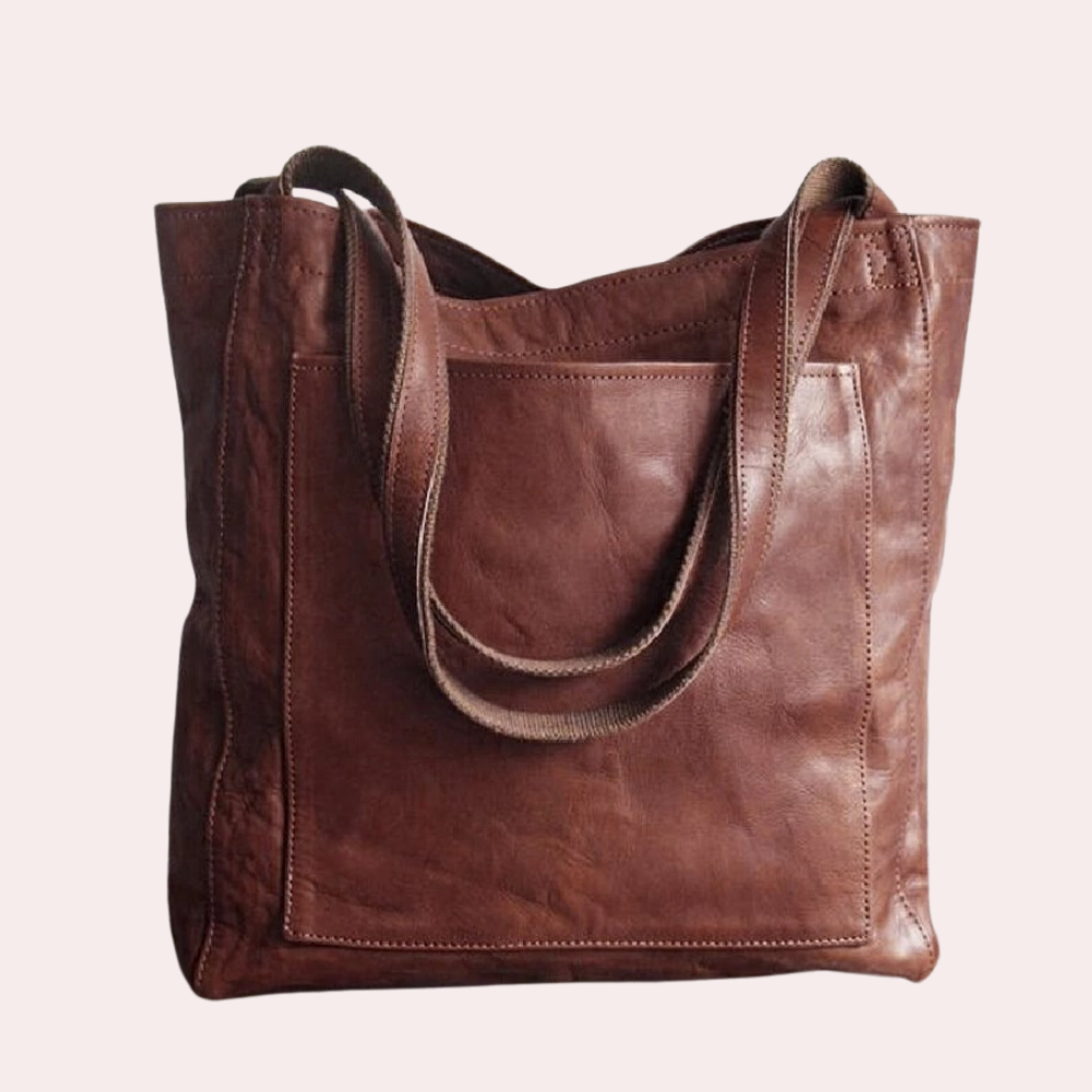Dunkelbraune Ledertasche, handgefertigt, geräumig, mit robusten Trägern. Perfekt für Alltag und Büro. Hochwertige Damenhandtasche.