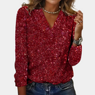 Funkelndes rotes Pailletten-Top für Damen, ideal für Partys. Elegantes Design mit V-Ausschnitt und langen Ärmeln. Perfekt für festliche Anlässe.
