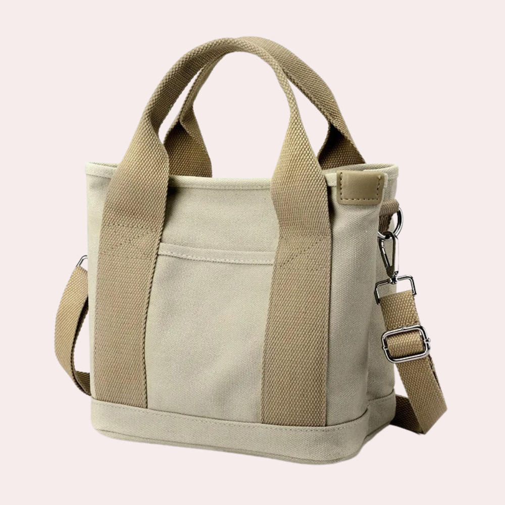 Khaki-Canvas-Tasche mit verstellbarem Schultergurt und robusten Griffen. Ideal für Alltag und Reisen. Stilvoll, praktisch, langlebig.