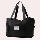 Schwarze Reisetasche aus robustem Material mit Tragegriffen, ideal für Reisen und Sport. Stilvoll, geräumig, langlebig. Perfekt für unterwegs.