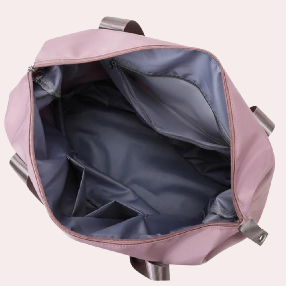 Geräumige rosa Reisetasche mit mehreren Fächern, ideal für Damen. Perfekt für Reisen, Sport und Alltag. Hochwertiges, strapazierfähiges Material.