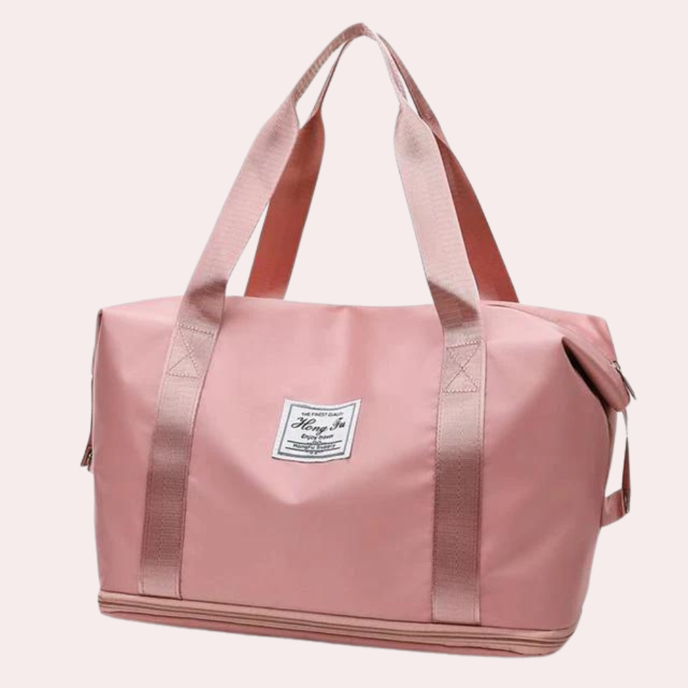 Rosa Reisetasche mit robusten Trägern, ideal für Damen. Perfekt als Sporttasche oder Weekender. Stilvoll und praktisch für Reisen.