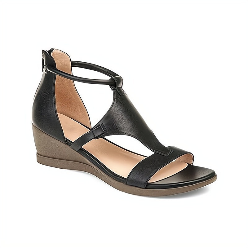 Schwarze Damen-Sandale mit Keilabsatz, offenem Zehenbereich und Knöchelriemen. Bequemes Design, ideal für Sommermode und Freizeitkleidung.