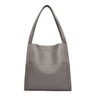 Elegante graue Ledertasche, minimalistisch und stilvoll, ideal für Damen. Perfekt für Alltag und Büro. Hochwertige Verarbeitung, zeitloses Design.