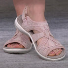 Damen-Sandalen in Rosa mit Kreuzriemen-Design, ideal für Sommermode. Bequeme, stilvolle Schuhe für Freizeit und Outdoor-Aktivitäten.