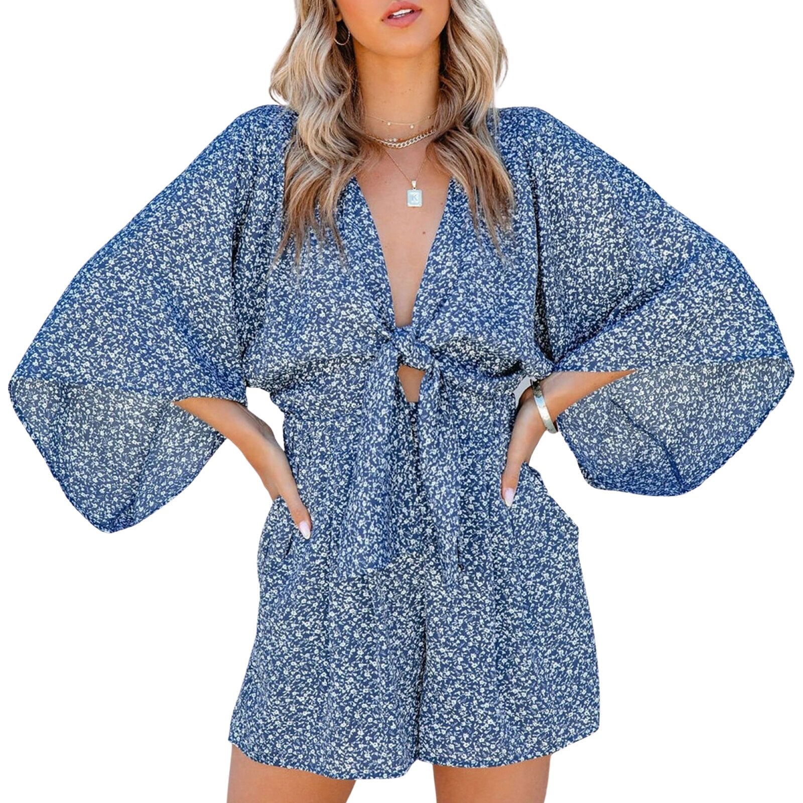 Damen Sommerkleid mit Blumenmuster, tiefem V-Ausschnitt und weiten Ärmeln. Perfekt für Strandmode und Freizeitoutfits. Trendig und bequem.