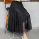 Eleganter schwarzer Tüllrock für Damen, knöchellang, ideal für modische Outfits. Perfekt für besondere Anlässe und stilvolle Alltagslooks.
