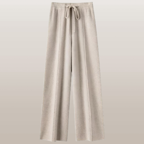 Beige Damenhose mit weitem Bein und Kordelzug, ideal für lässige Outfits. Perfekt für Komfort und Stil im Alltag. Hochwertige Stoffqualität.