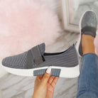 Graue Damen-Sneaker mit Klettverschluss, rutschfeste Sohle, atmungsaktives Strickmaterial, ideal für verbesserte Laufhaltung und Komfort.