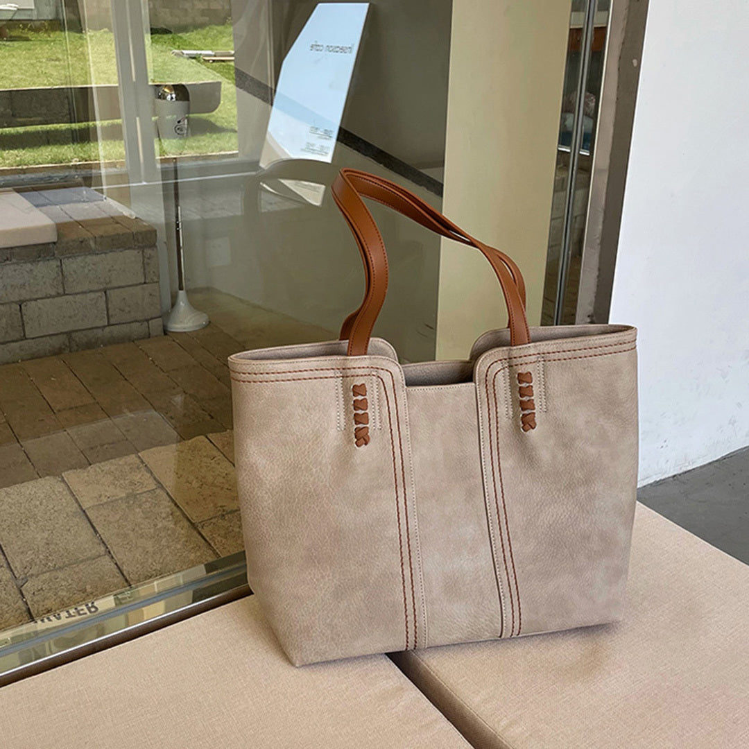 Khaki-farbene Handtasche aus Lederimitat mit braunen Griffen, elegant und geräumig, ideal für den Alltag. Perfekt für stilvolle Damen.