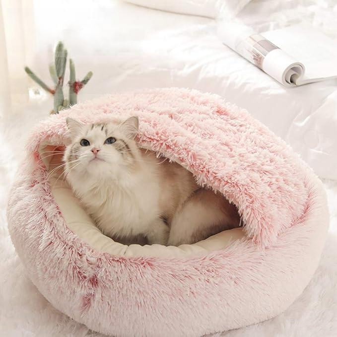 Kuscheliges Katzenbett in Rosa, ideal für Haustiere. Flauschiges Design, perfekt für Katzenkomfort. Hochwertiges Material, stilvoll und gemütlich.