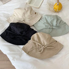 Damen Fischerhut mit Schnürung, leicht und winddicht, idealer Sonnenschutz. Erhältlich in Beige, Schwarz, Blau und Khaki. Perfekt für Sommermode.