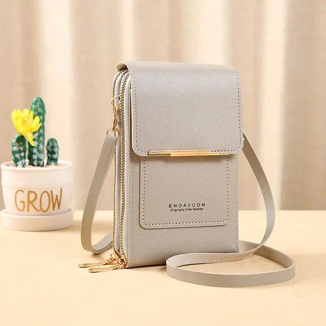 Graue Damen-Umhängetasche aus Leder mit Reißverschluss, elegant und modern.