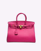 Pinke Lederhandtasche mit goldener Schnalle, modisch, elegant, Damenaccessoire, Luxus-Tasche.