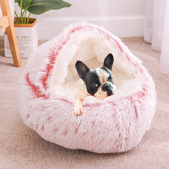 Kuscheliges Katzenbett in Rosa-Weiß mit weichem Plüsch, ideal für Haustiere. Perfekt für Komfort und Stil im modernen Zuhause.
