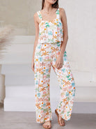 Damen-Zweiteiler mit tropischem Muster, ärmelloses Top und weite Hose, ideal für Sommermode, Freizeitkleidung, Strandoutfit.
