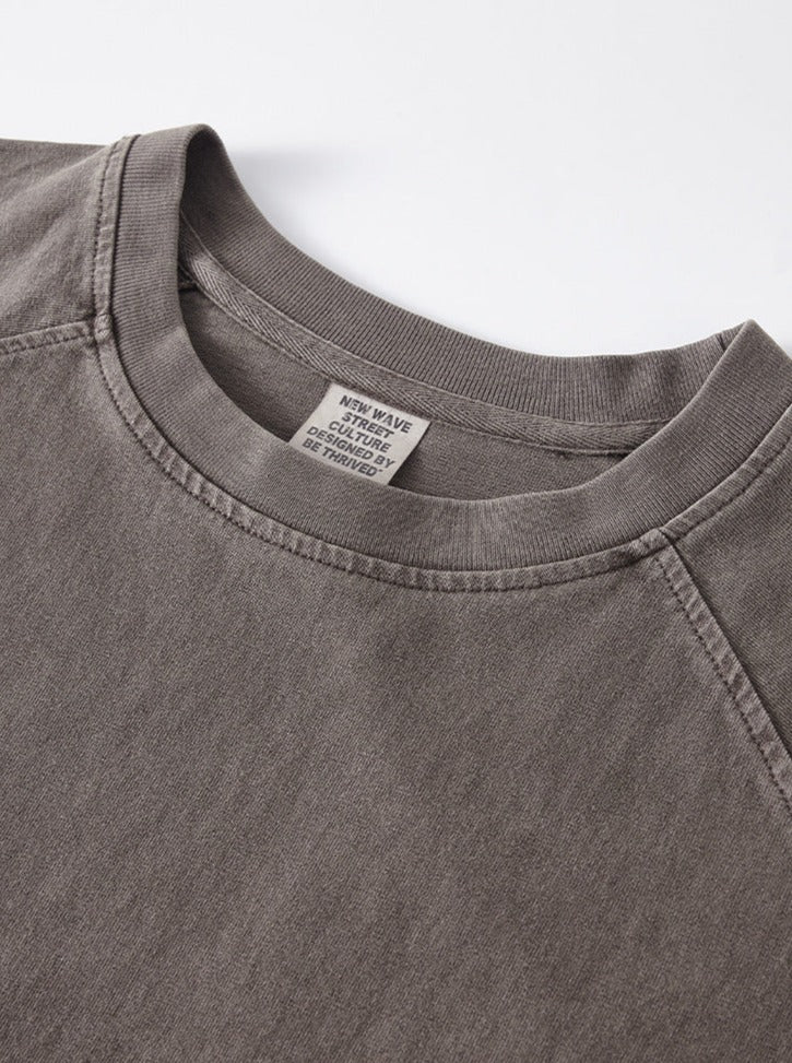 Graues T-Shirt aus Baumwolle, Rundhalsausschnitt, lässiger Stil, hochwertige Verarbeitung, ideal für Freizeitmode und Alltagskleidung.