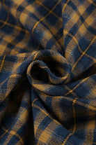 Kariertes Flanellstoffmuster in Blau und Gelb, ideal für Hemden und Decken. Weicher, warmer Stoff, perfekt für Herbst- und Wintermode.