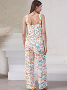 Damen Jumpsuit mit tropischem Blumenmuster, ärmellos, lässig, ideal für Sommermode. Perfekt für Strand, Urlaub und Freizeit.