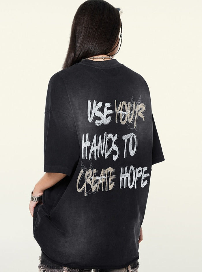 Schwarzes T-Shirt mit Aufdruck "Use Your Hands to Create Hope", lässiger Stil, Unisex, Baumwolle, Streetwear, modisches Design, Rückansicht.