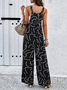 Damen Jumpsuit schwarz-weiß, abstraktes Muster, ärmellos, Sommermode, lässig, eleganter Look, ideal für Strand und Freizeit.