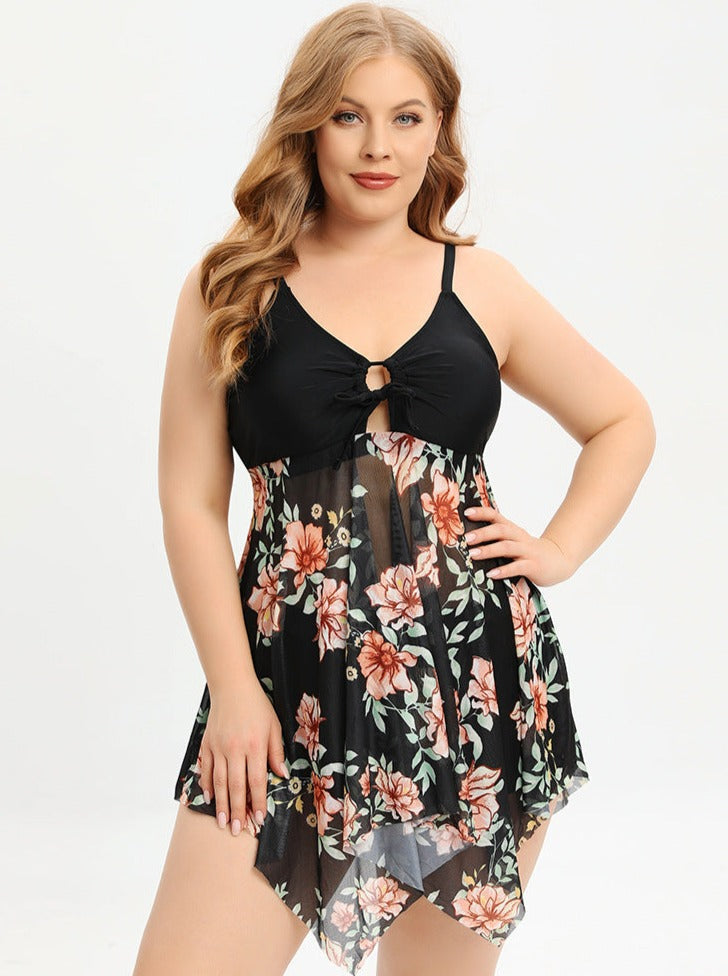 Feminines Plus-Size-Kleid mit floralen Mustern, ärmellos, V-Ausschnitt, ideal für Sommermode. Elegantes Design, bequem und stilvoll.