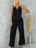 Elegante schwarze Damenhose mit passender Weste, ideal für stilvolle Anlässe. Modisches Design, hochwertige Stoffe, zeitloser Look.