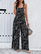Damen Jumpsuit mit abstraktem Muster, ärmellos, schwarz-weiß, lässig, Sommermode, bequem, trendig, ideal für Freizeit und Strand.