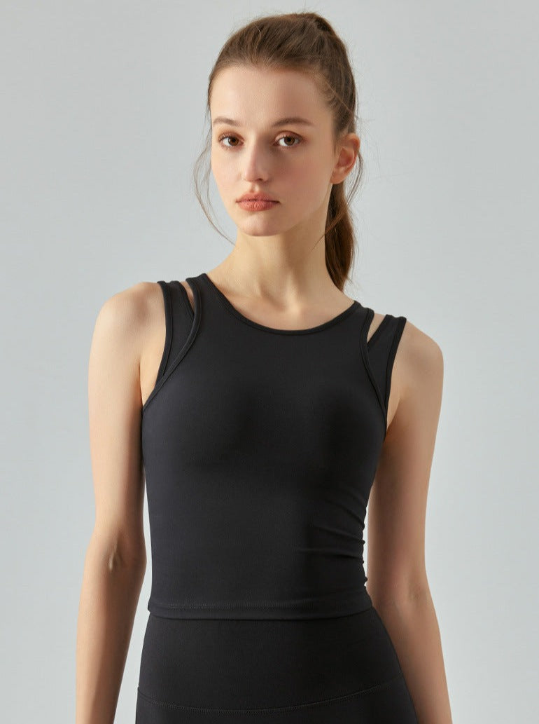 Damen-Sporttop in Schwarz, ärmellos, atmungsaktiv, ideal für Fitness und Yoga. Hochwertiges Material, figurbetont, modisch und bequem.