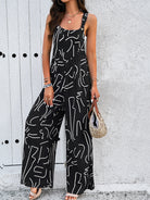 Damen Jumpsuit schwarz-weiß, abstraktes Muster, ärmellos, lässig, Sommermode, trendige Overalls, bequeme Passform, modische Damenbekleidung.