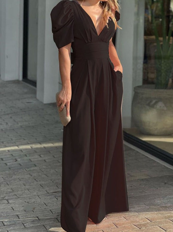 Elegantes schwarzes Abendkleid mit Puffärmeln und V-Ausschnitt, ideal für formelle Anlässe. Perfekt für stilvolle Damenmode und Abendgarderobe.