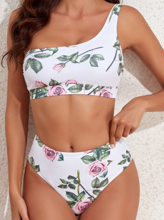 Damen-Bikini mit floralem Muster, asymmetrischem One-Shoulder-Top und hochgeschnittener Taille. Perfekt für Strandmode und Sommertrends.