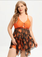 Damen-Badeanzug in leuchtendem Orange mit Palmenmuster, transparentem Überwurf und V-Ausschnitt. Perfekt für Strandmode und Sommerurlaub.