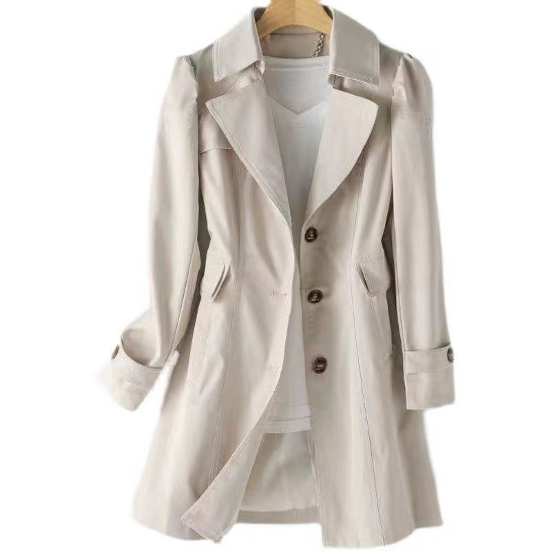 Eleganter Off-White Trenchcoat für Damen, klassisches Design, ideal für Herbstmode. Hochwertiger Stoff, zeitloser Stil, vielseitig kombinierbar.