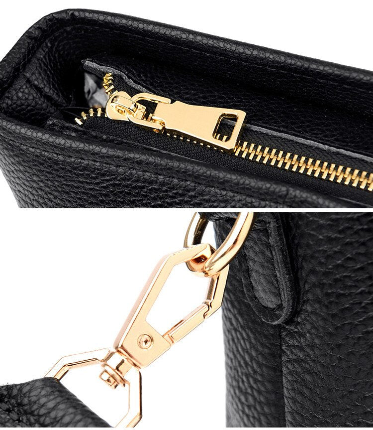 Schwarze Lederhandtasche mit goldfarbenem Reißverschluss und Karabinerhaken. Elegantes Design, hochwertige Materialien, modisches Accessoire.