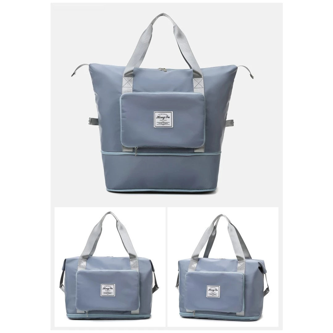 Große graue Reisetasche mit robusten Griffen, Fronttasche und Reißverschluss. Perfekt für Reisen, Sport und Alltag. Hochwertiges, langlebiges Material.