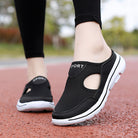 Schwarze Damen-Sportschuhe mit atmungsaktivem Mesh, rutschfester Sohle und modernem Design. Perfekt für Laufen und Freizeitaktivitäten.