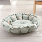 Rundes, graues Hundebett mit Blumenmuster, weiches Material, ideal für kleine Haustiere.